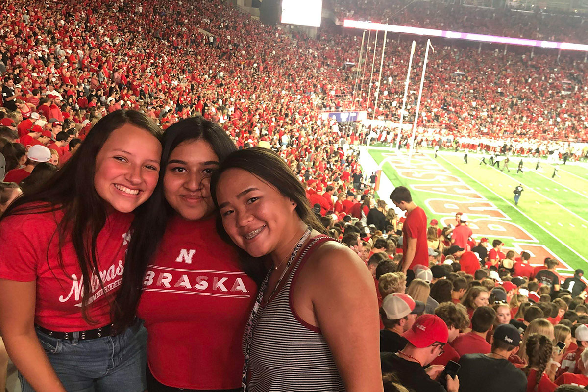 Malayna with friends at a football game