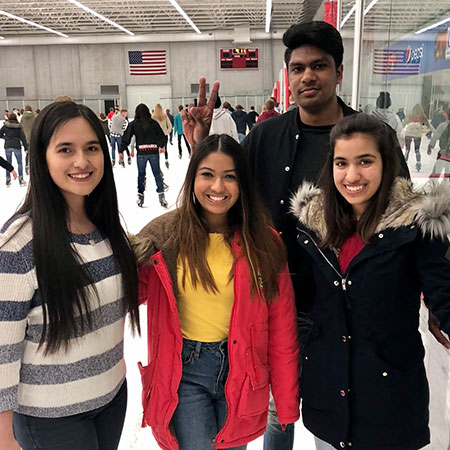 Nidhi with friends at an ice rink